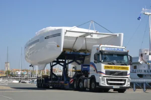 Catamaran hull on a low-loader truck as an oversize road transport
