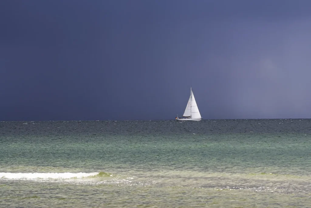 Sailing yacht on the Baltic Sea under a dark sky