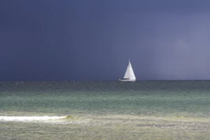 Sailing yacht on the Baltic Sea under a dark sky