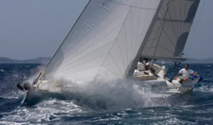 Skipper and crew sailing a yacht hard on the wind