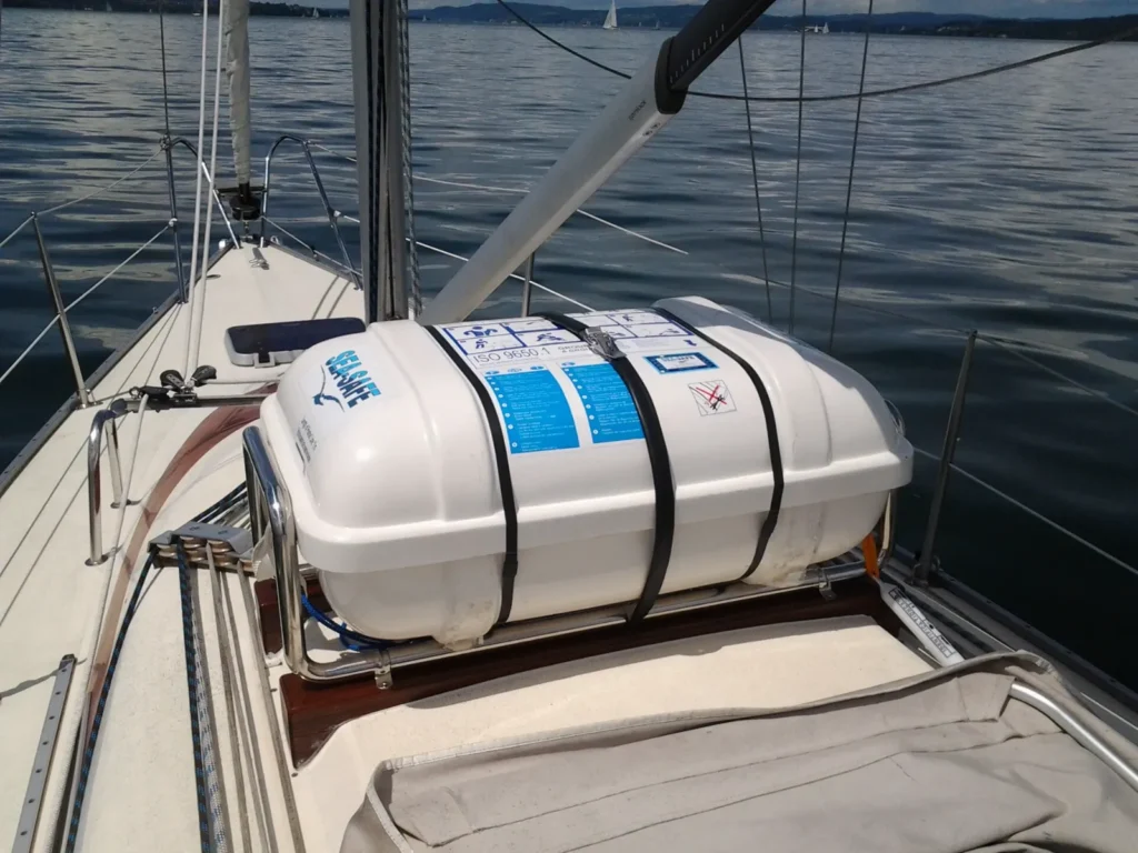 Life raft canister mounted on the deck of a sailing yacht