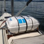 Life raft canister mounted on the deck of a sailing yacht