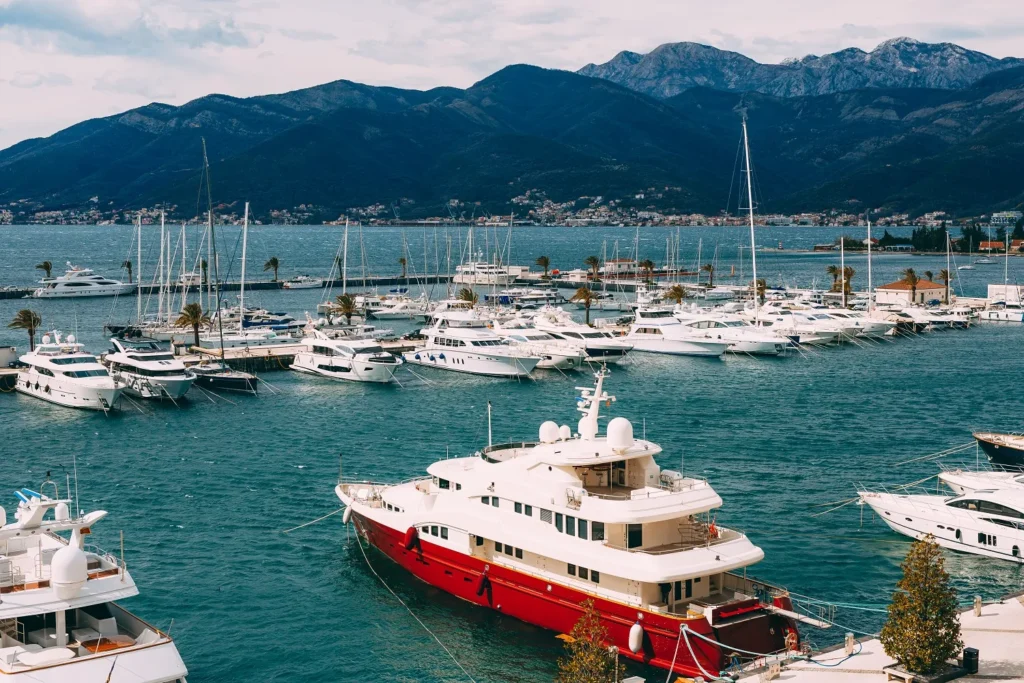 Yachts moored at the pier in Porto Montenegro marina